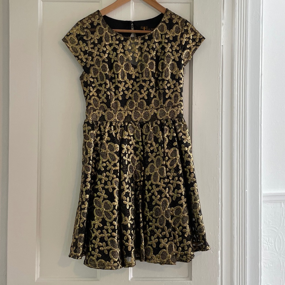 Black and gold cocktail dress.